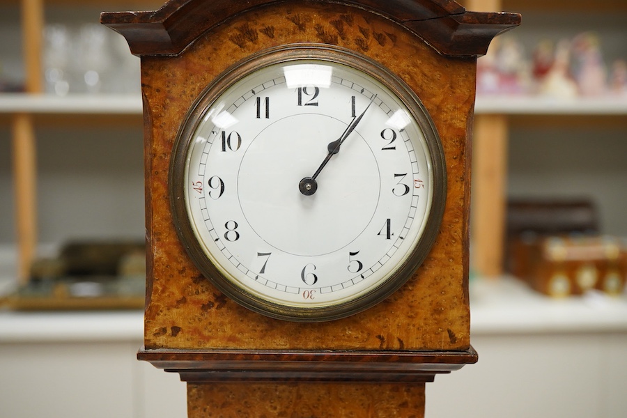 A small French amboyna model of a longcase timepiece, with key, 44cm high